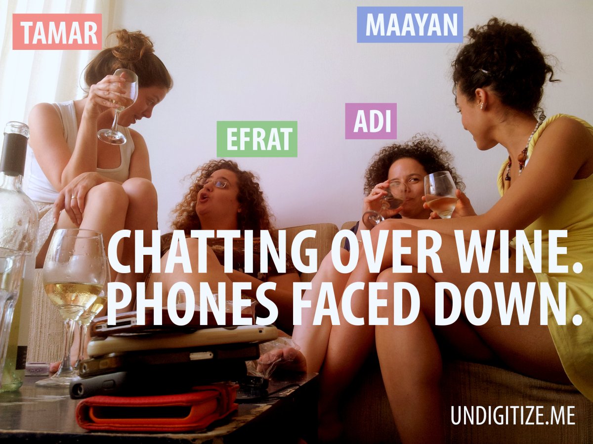 Chatting Over Wine. Phone Faced Down.